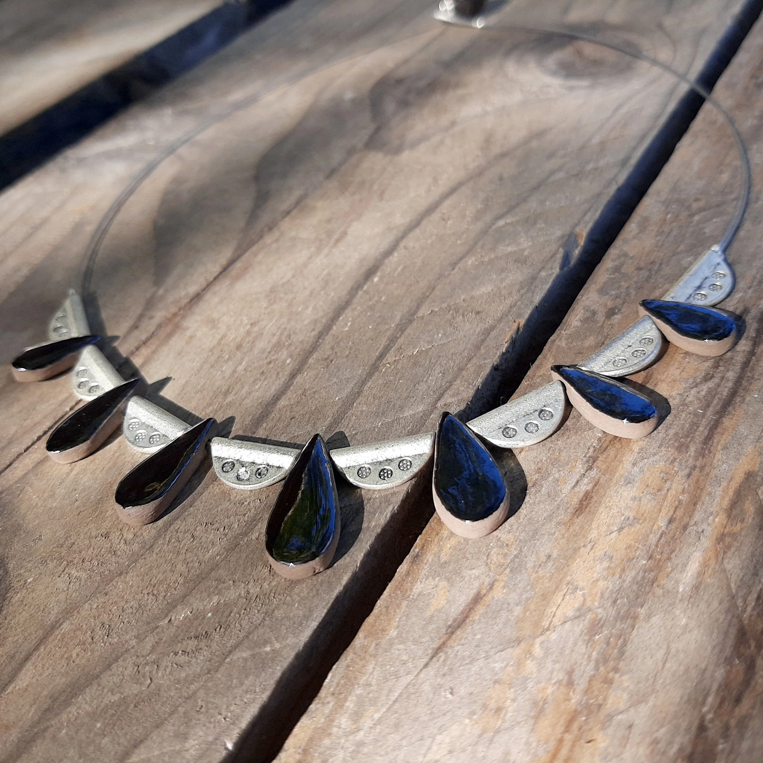 Handmade drop ceramic necklace, shiny goldy black