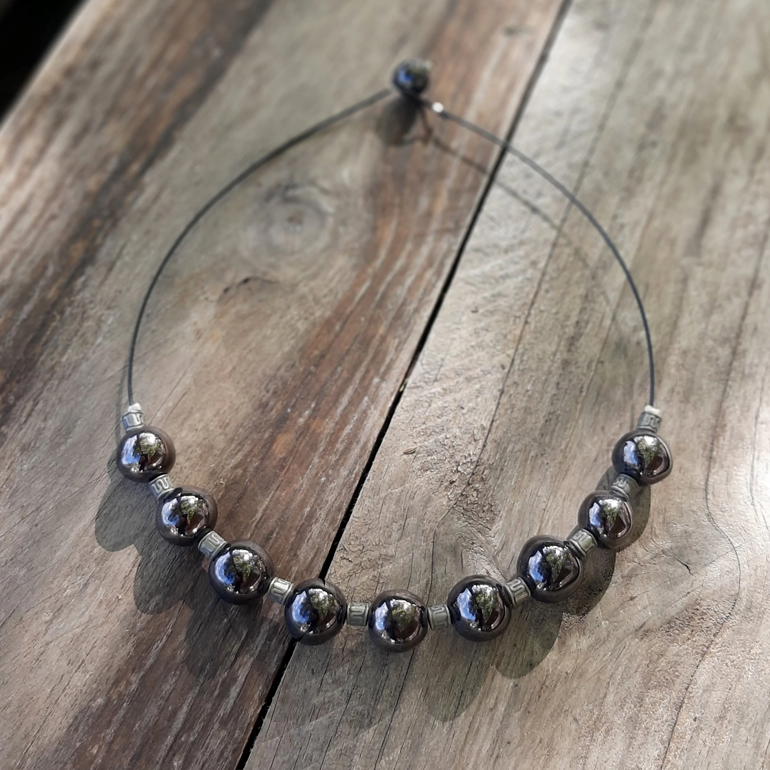 Handmade ceramic balls necklace, goldy black