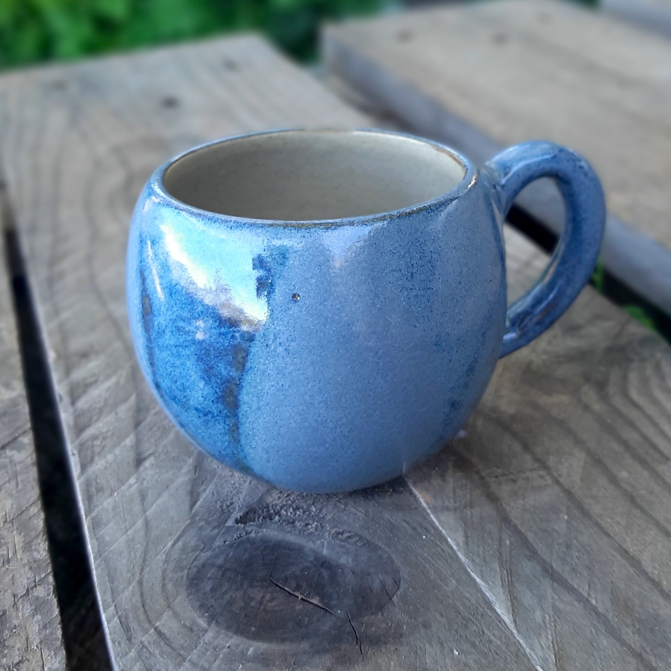 Round stoneware ceramic coffee cup, night blue and cream