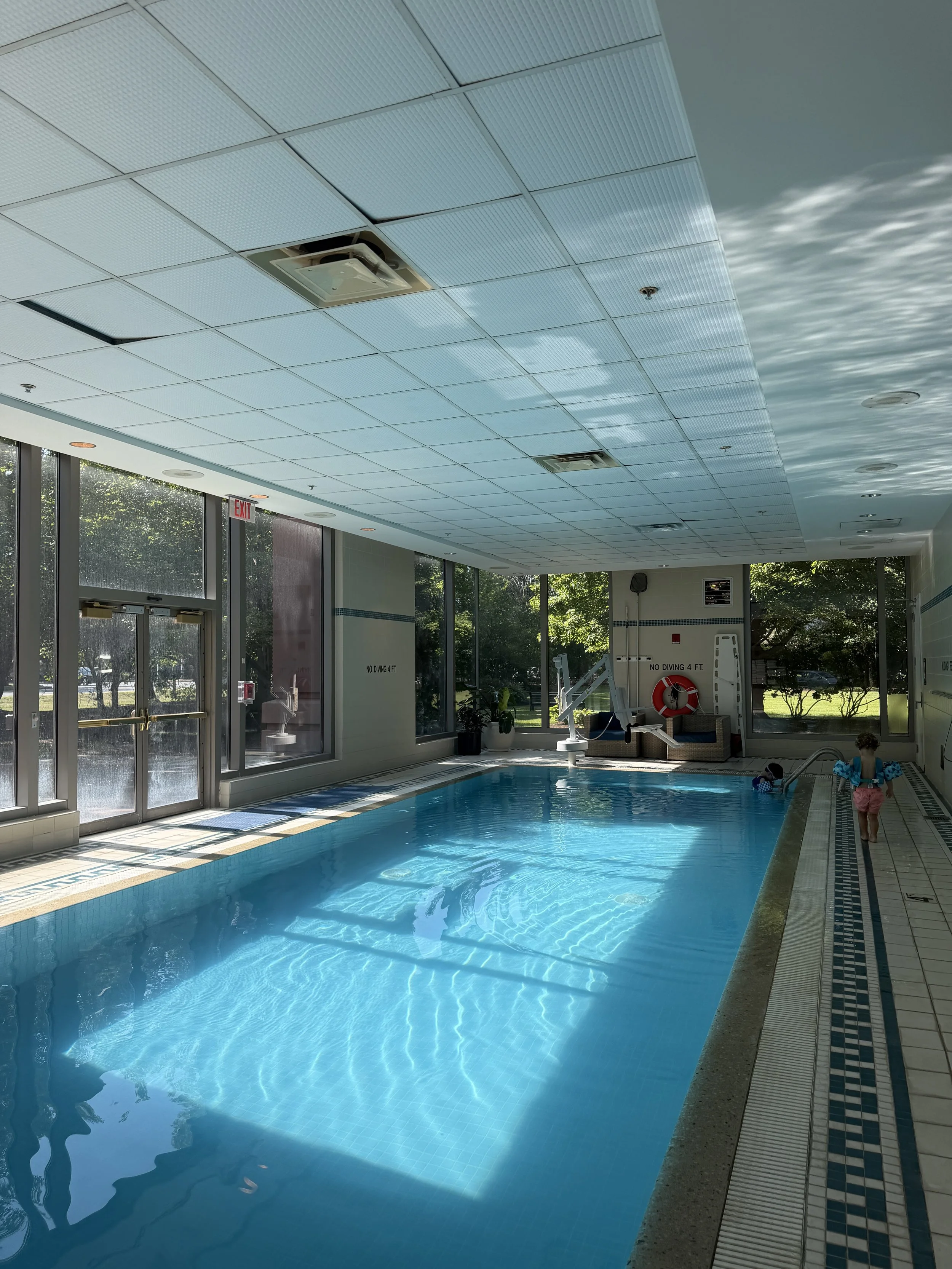 Kids swimming in the hotel pool during a Boston family trip