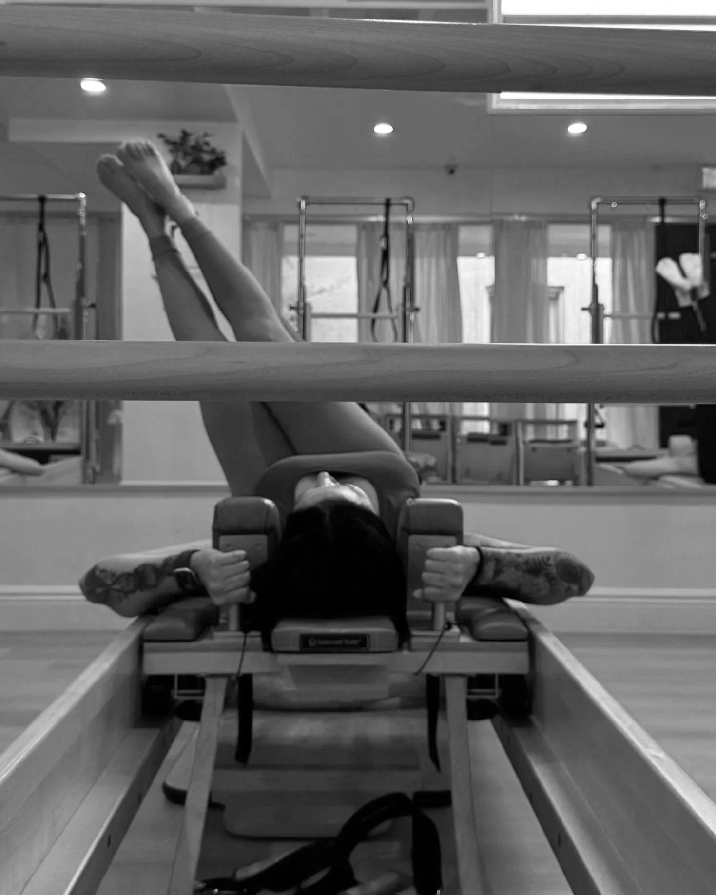 Pilates client performing reformer exercises at Ritual Body Pilates in Fort Lauderdale