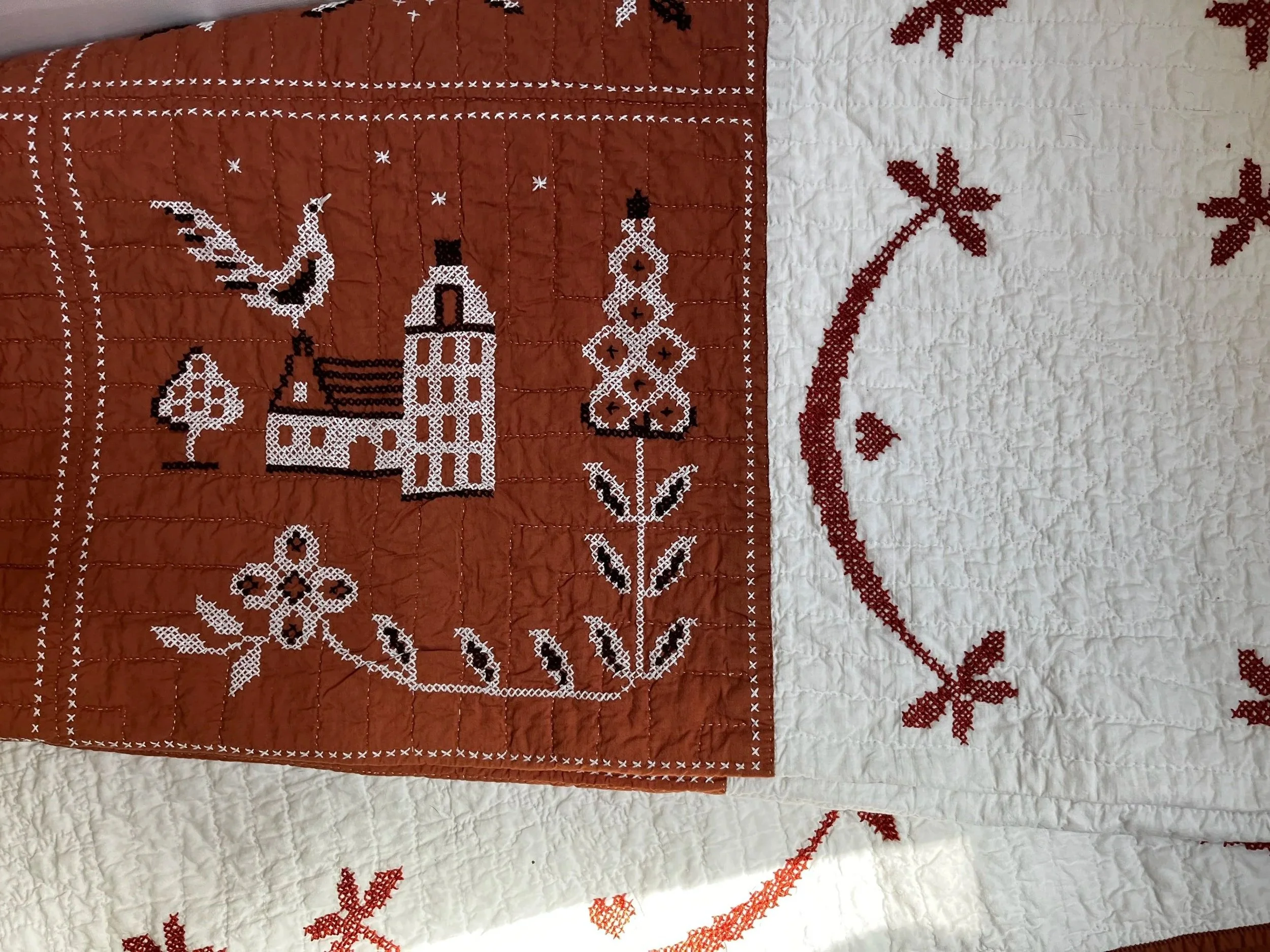 Vintage hand embroidered folk art quilt