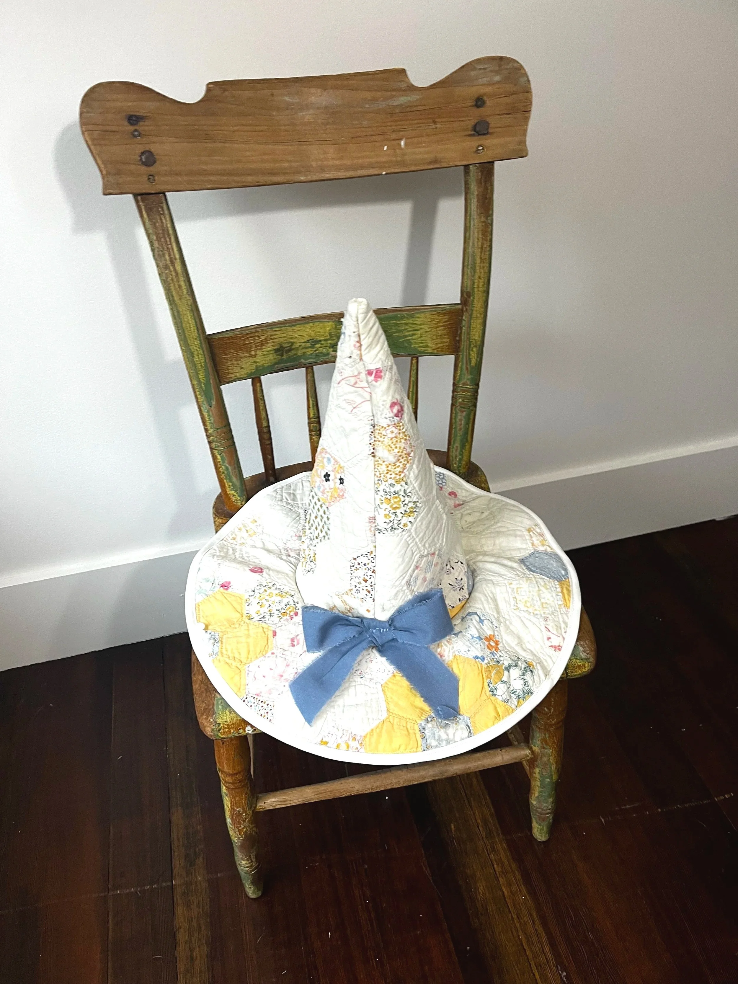 Custom wearable witch hat created from distressed quilt