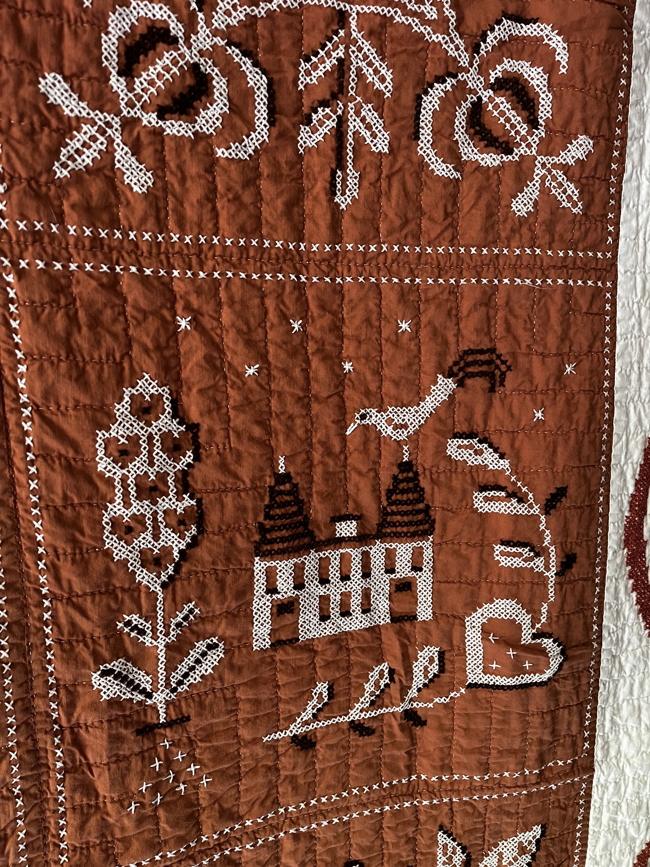 Vintage hand embroidered folk art quilt