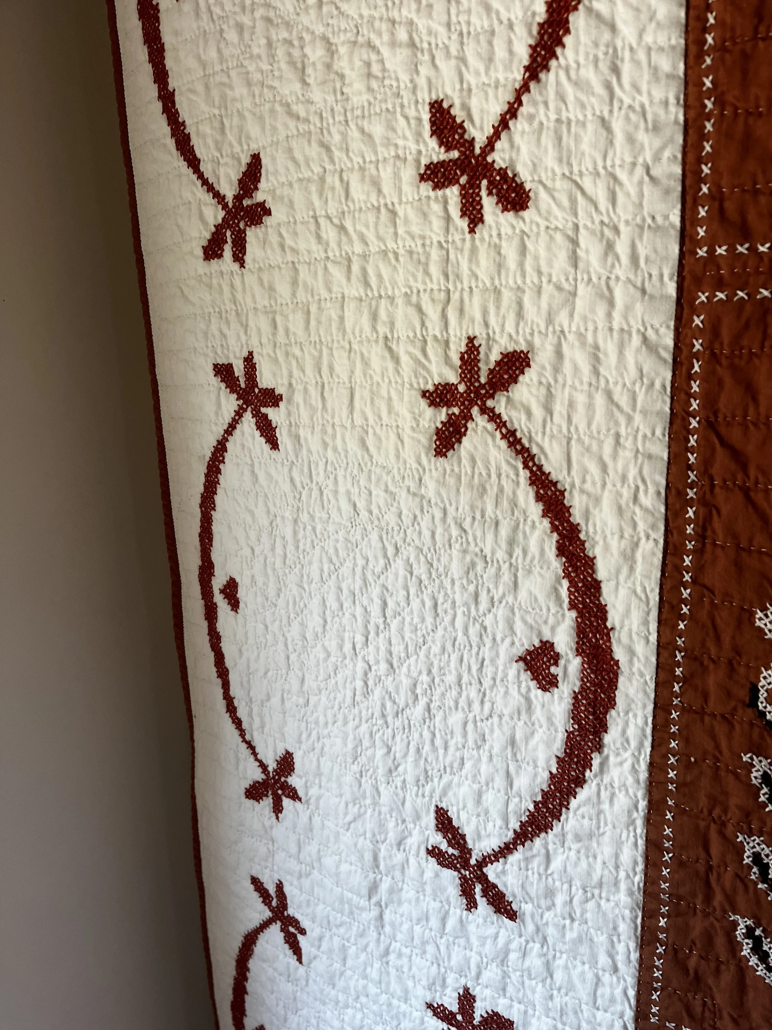 Vintage hand embroidered folk art quilt