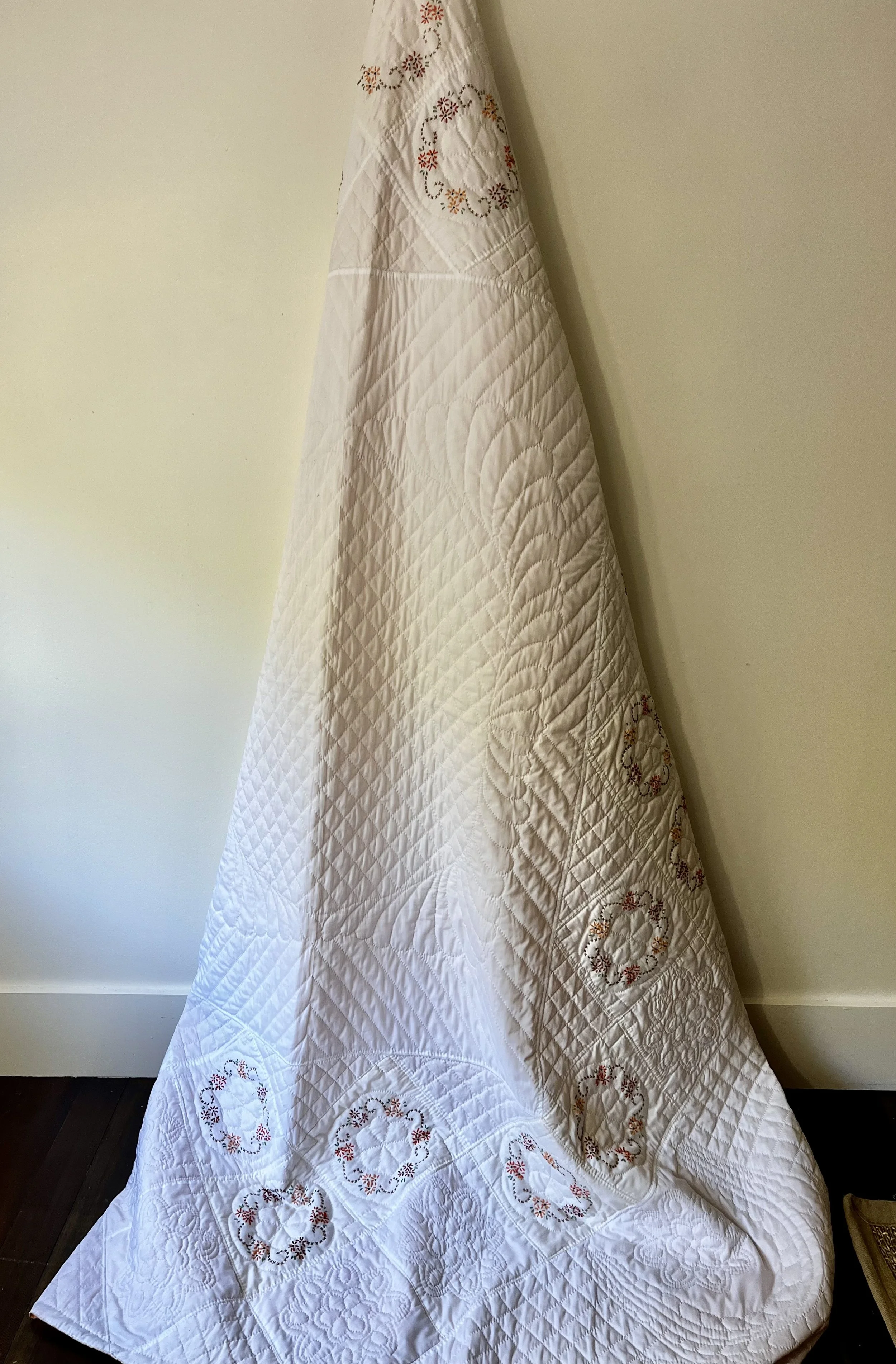 Vintage hand-quilted and hand-embroidered quilt