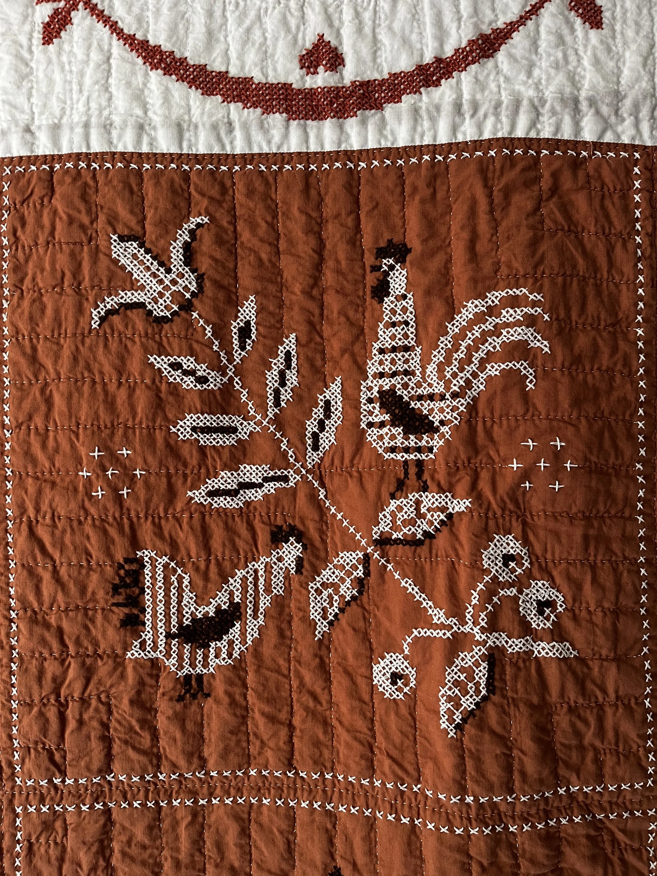 Vintage hand embroidered folk art quilt