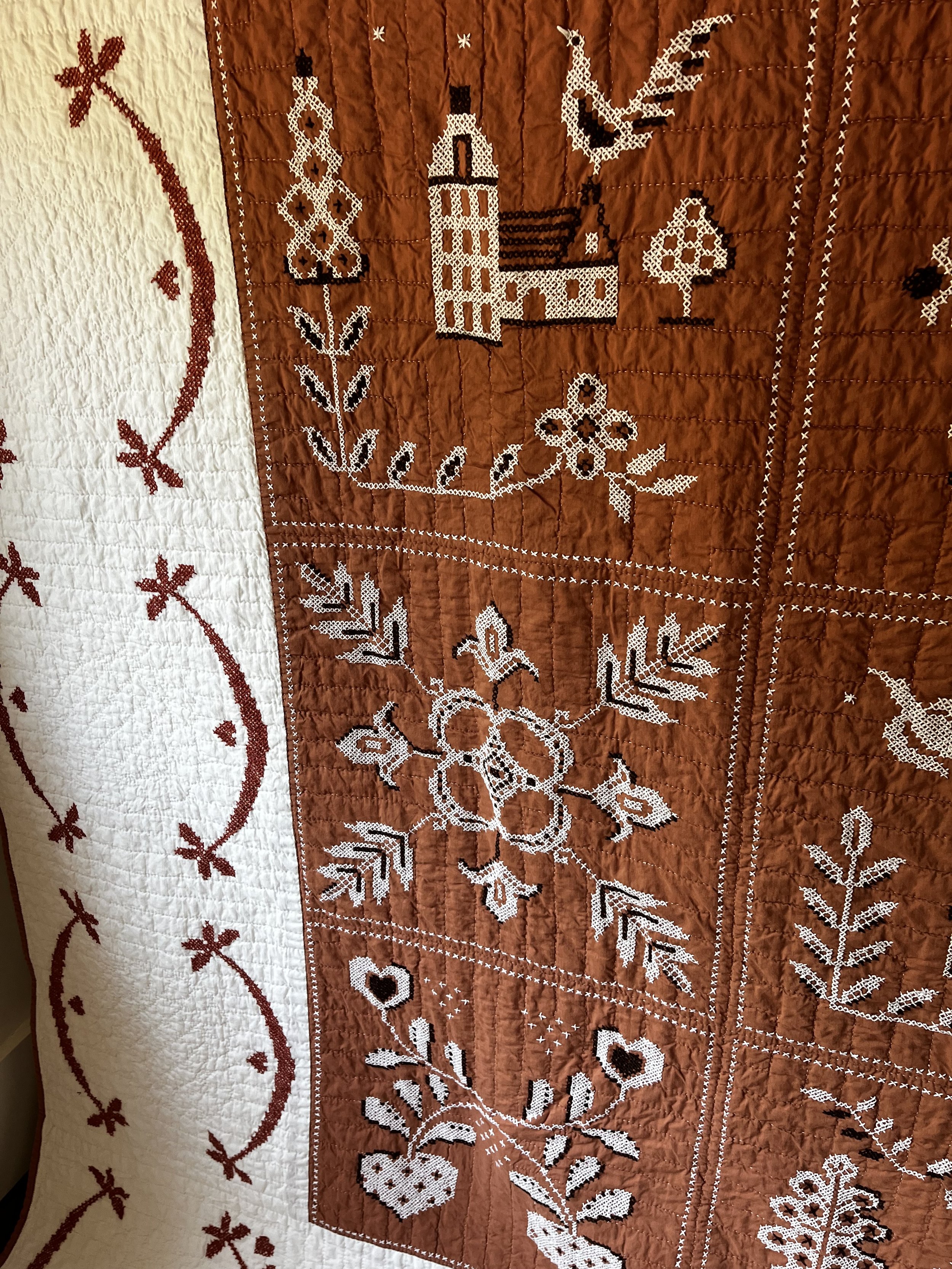 Vintage hand embroidered folk art quilt