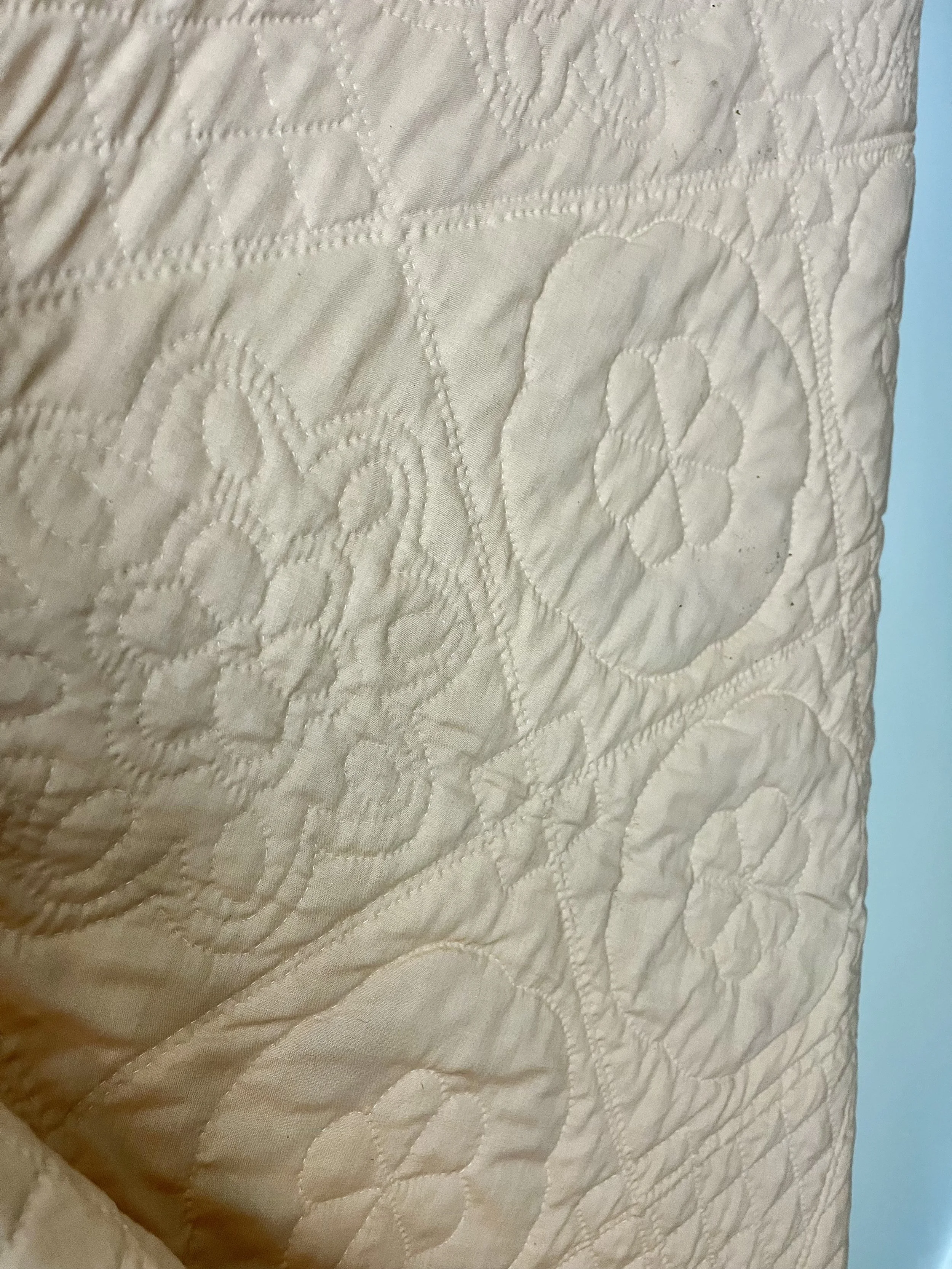 Vintage hand-quilted and hand-embroidered quilt