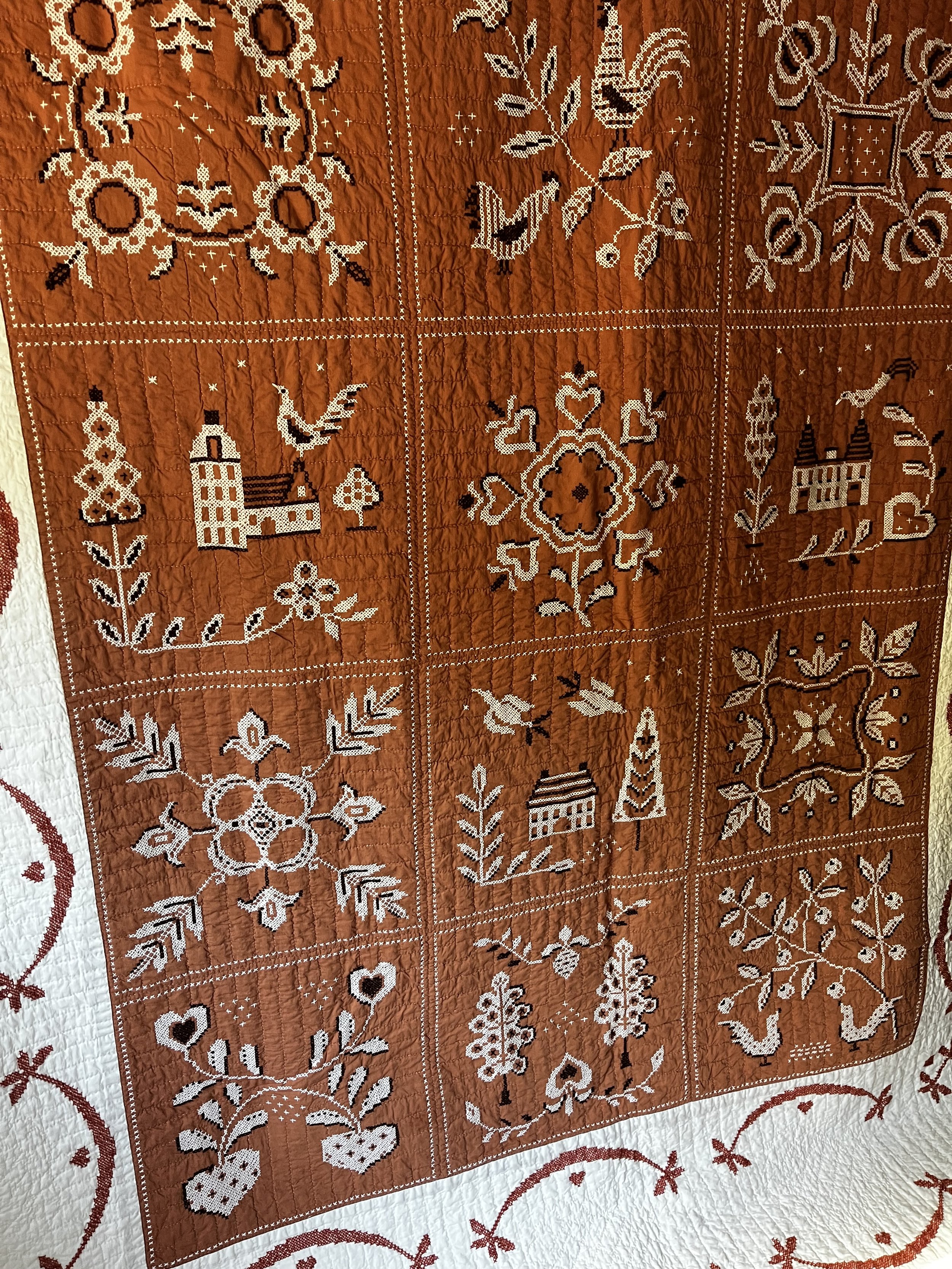 Vintage hand embroidered folk art quilt