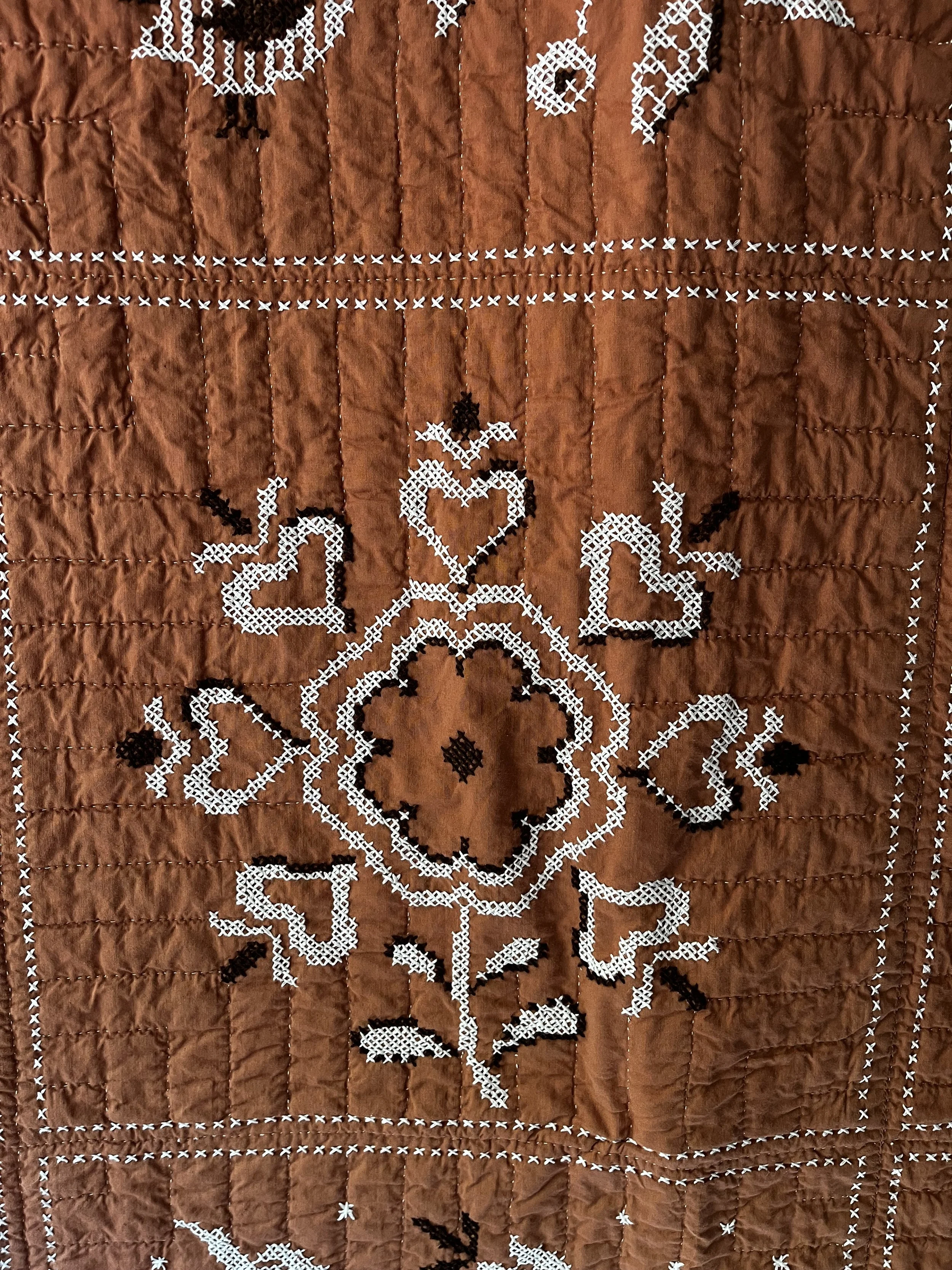 Vintage hand embroidered folk art quilt