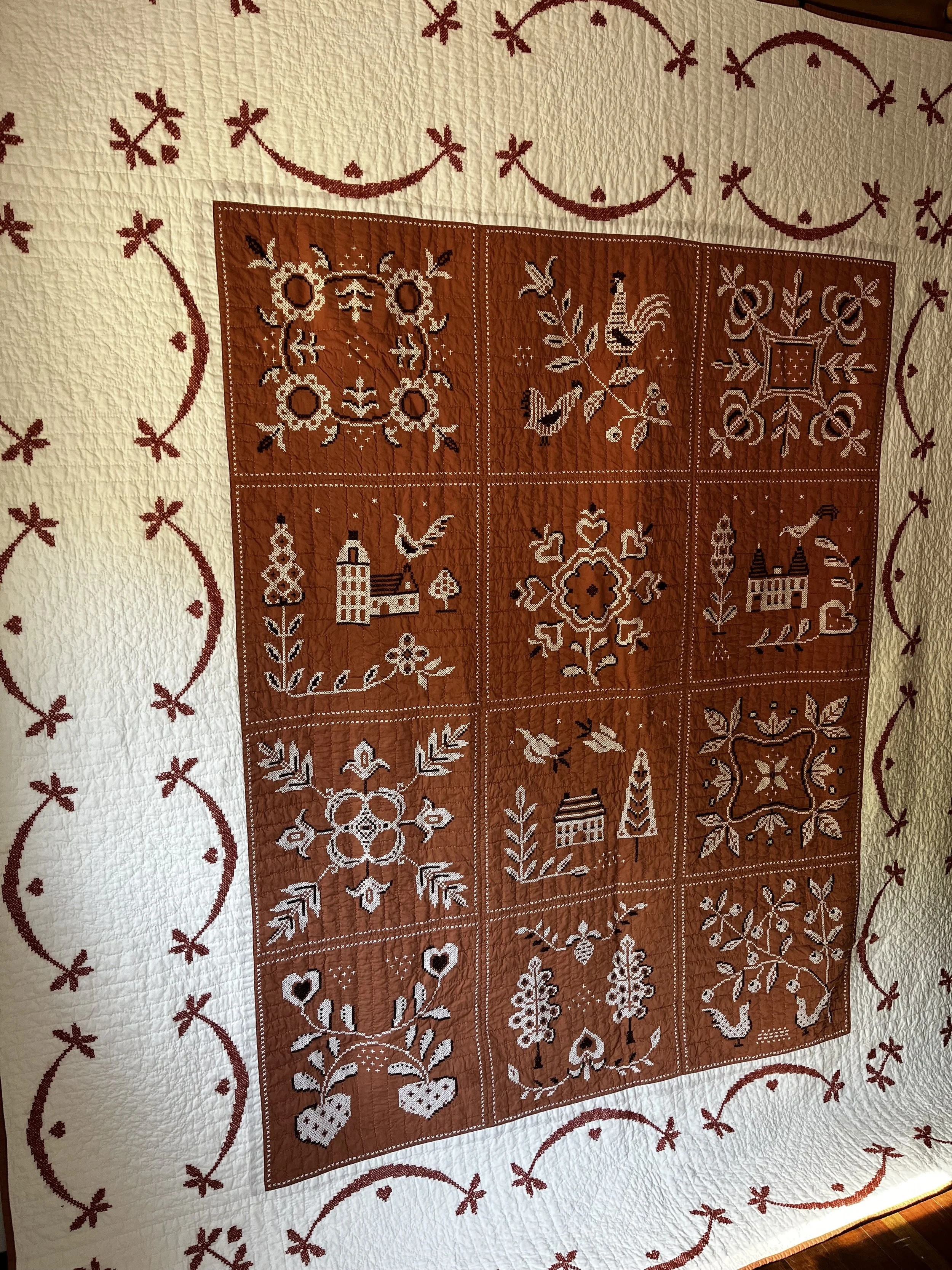 Vintage hand embroidered folk art quilt