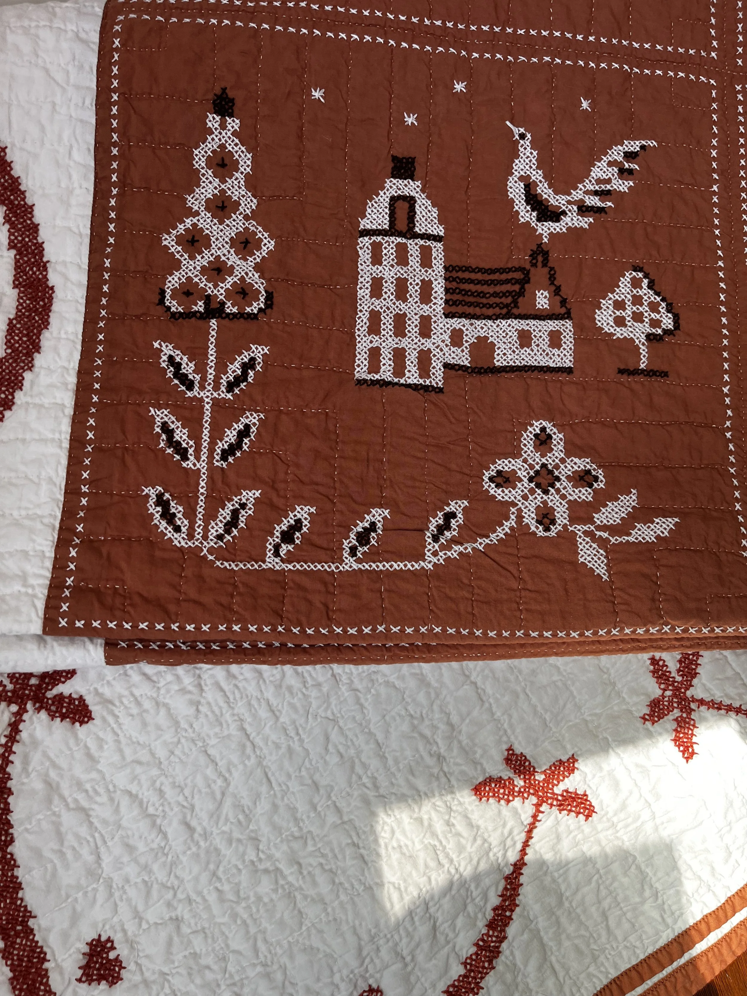 Vintage hand embroidered folk art quilt