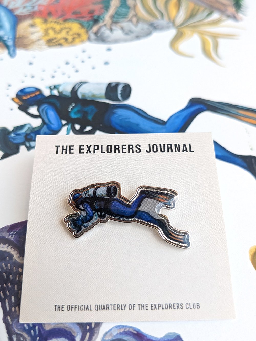 Merchandise for The Explorer's Club- pins, t-shirts, sweatshirt, tote bag, poster