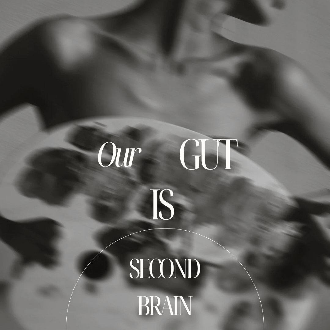 A black-and-white close-up photograph of a human brain with the text overlay "Our GUT IS SECOND BRAIN" in white letters.