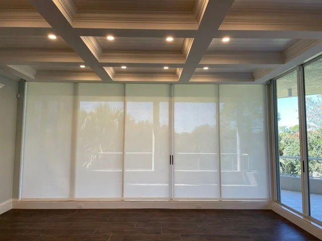 2 Light filtering Rollershades, Mounted at the ceiling in a pocket made by the contractor.jpg
