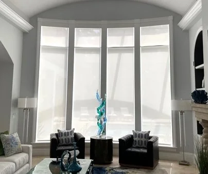 Great Room with inside mount roller shades done in 5 percent brigt white and covered with 5 inch wood valances.jpg