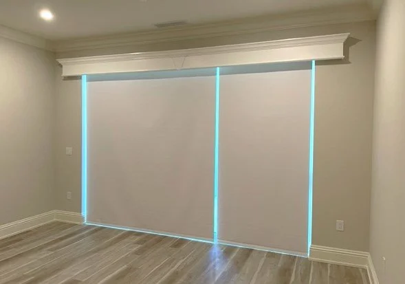 Two room darkening roller shades with a 8 inch wood painted valance that has bottom bead and a crown on top.jpg