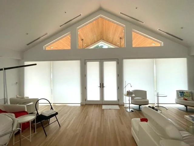 Family room, roller shades and plain wood valances.jpg