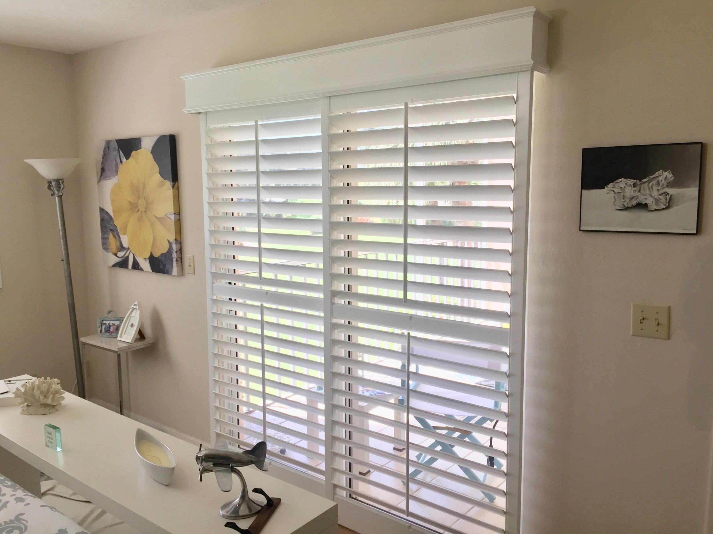 Center tilt rod OSMT Sliding Shutter, Box with Bead top and bottom, panels stack on glass 1.jpg