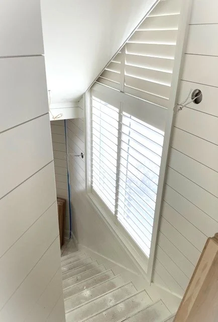 Flight of stairs with clearview plantation shutters fitting into the steps.jpg