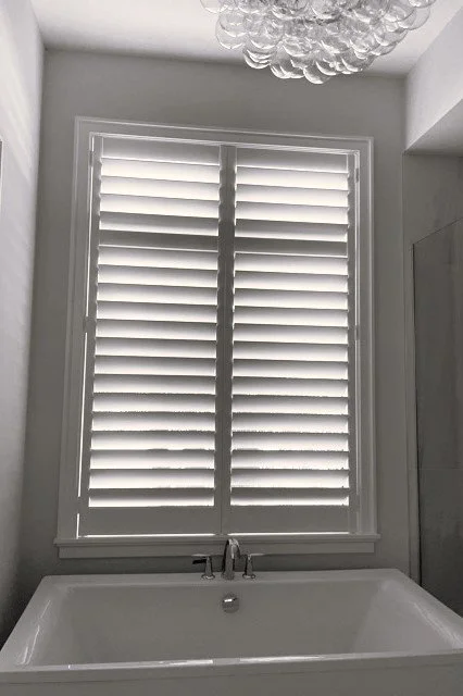 Clearview Shutter above tub with awesome light fixture 2 Panel 3.5 Louvers.jpg