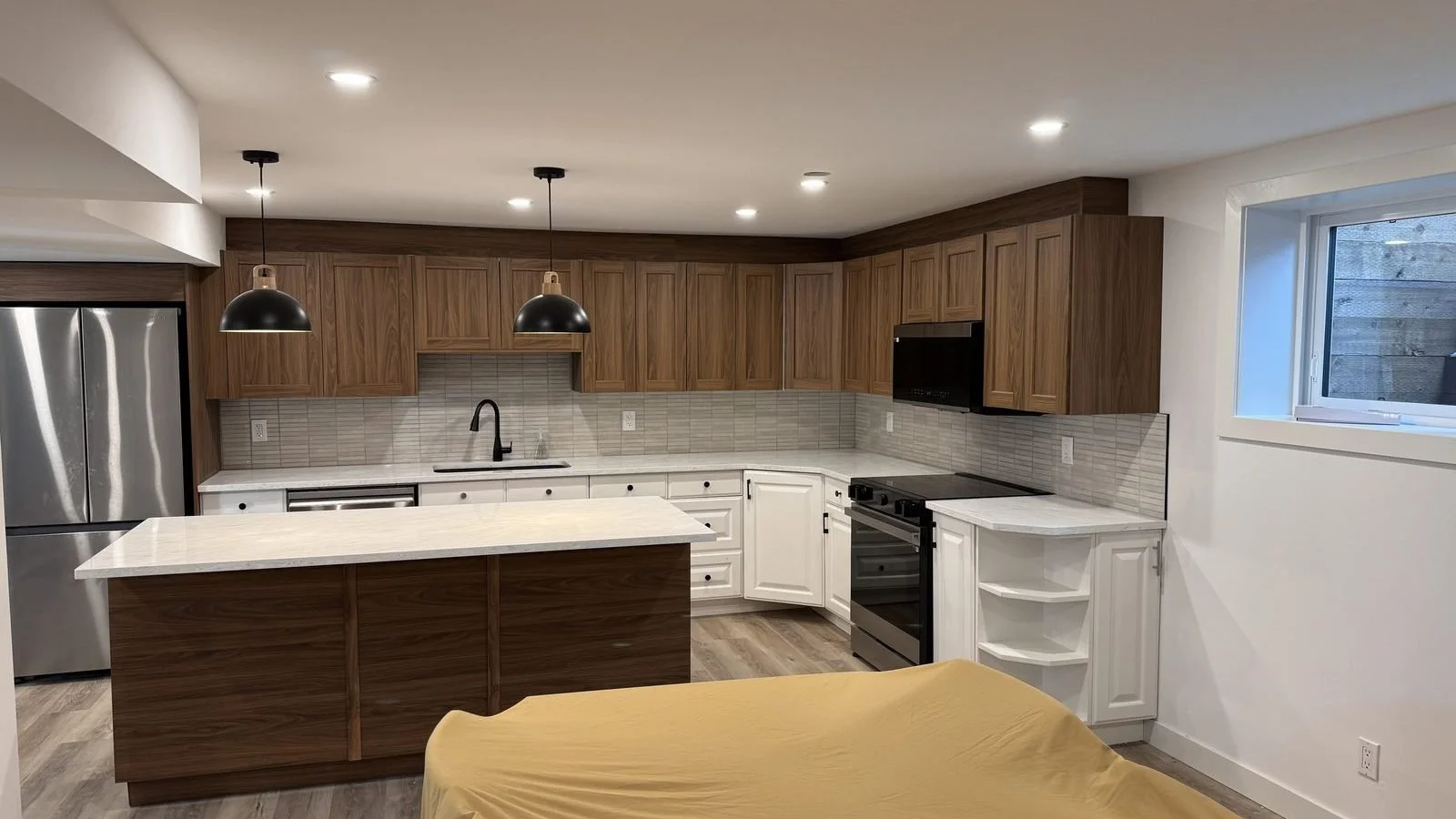 Legal basement suite kitchen in Midnapore, Calgary: before and after