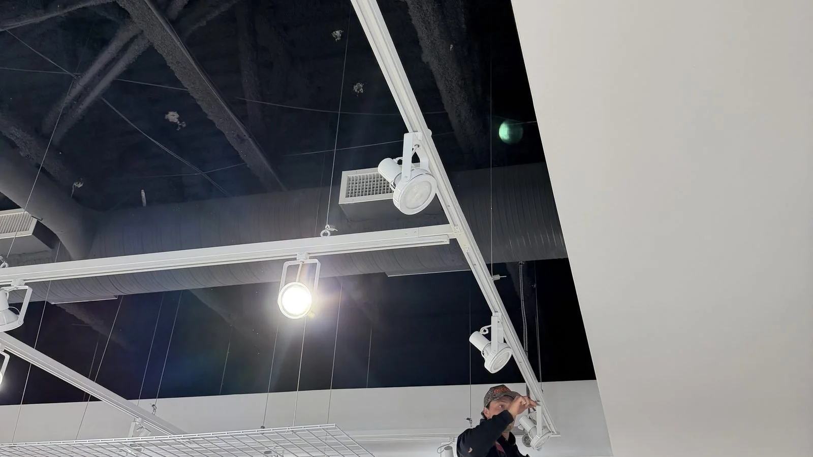 Track lighting retrofit for Ardene, Southcentre Mall, Calgary