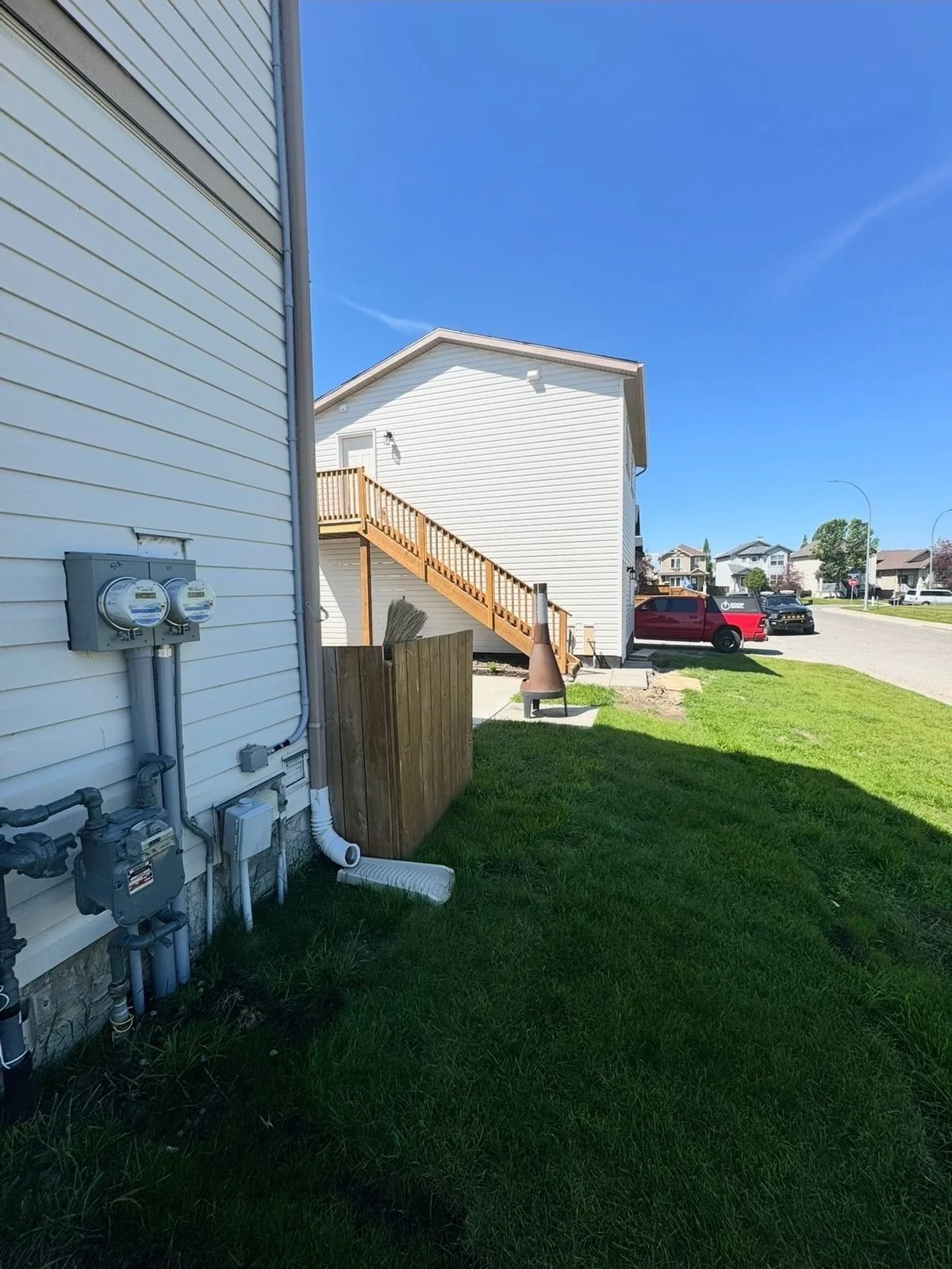 Two-gang meter base with separate meters for the house and the nanny suite, installed by Koop Electrical in Cimarron, Okotoks