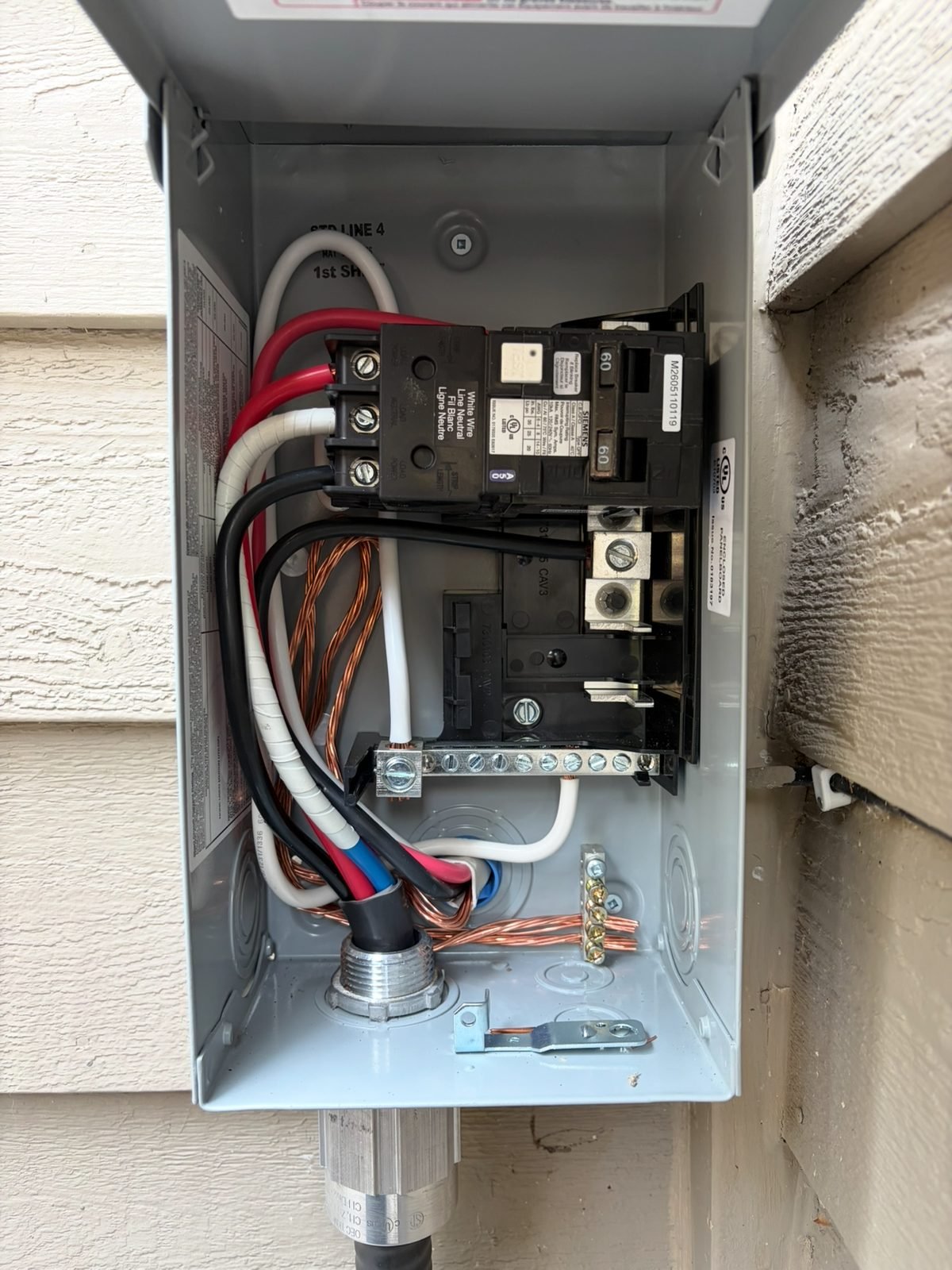 Inside the 50 amp GFCI spa disconnect: breaker and wiring for a hot tub circuit installed by Koop Electrical near Calgary