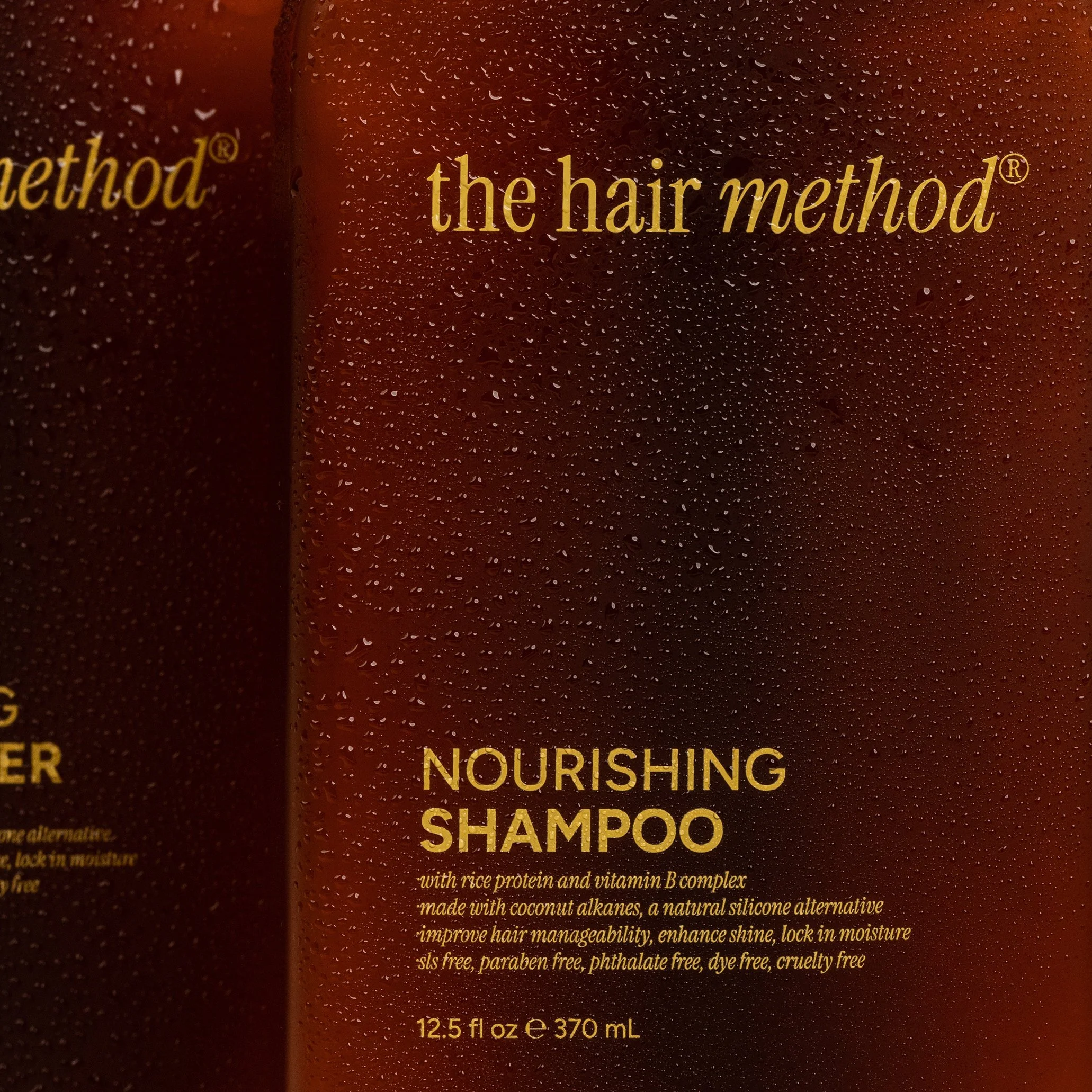Close-up of hair shampoo bottle with water droplets, featuring product name and details in gold text on a dark background.