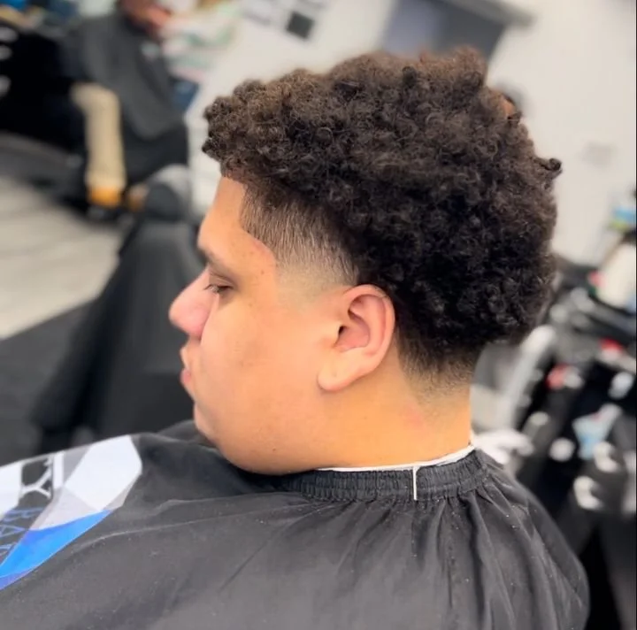 men's top curly cut