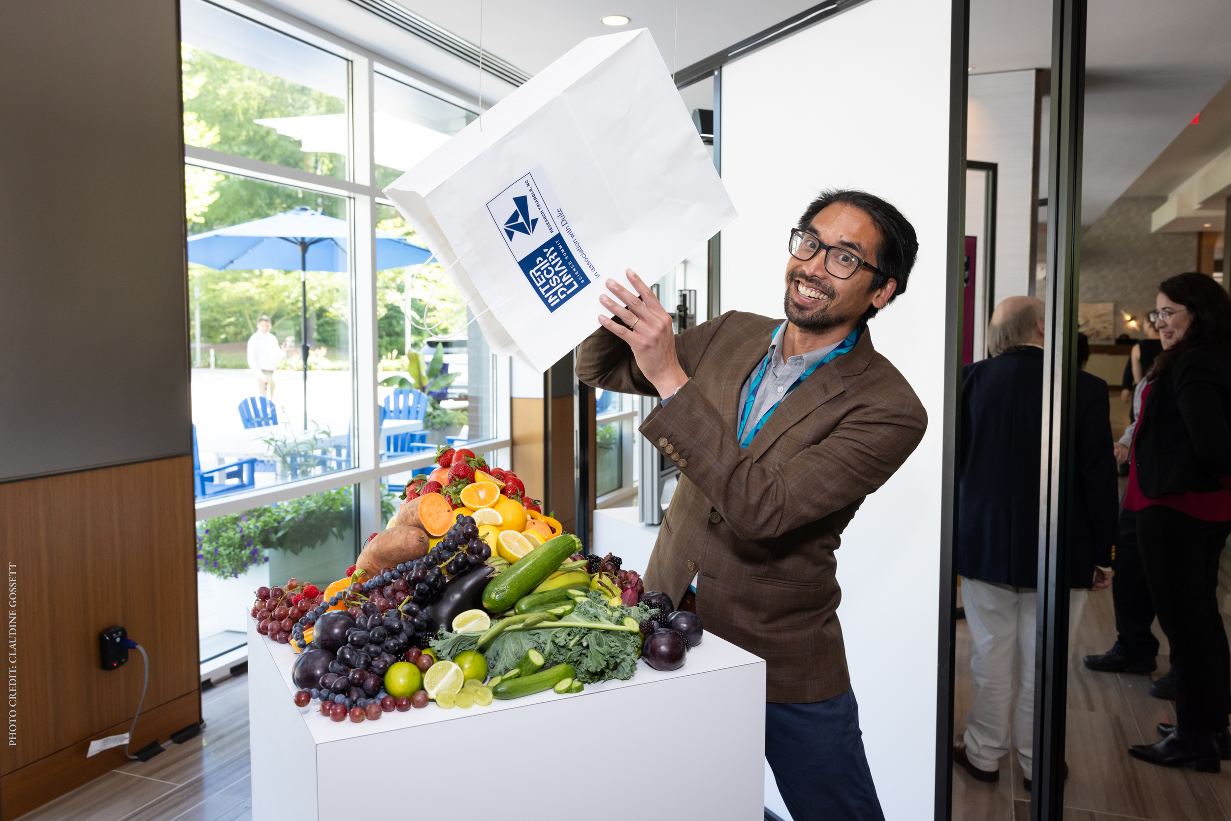 Lawrence overturning groceries - credit Claudine Gossett.png