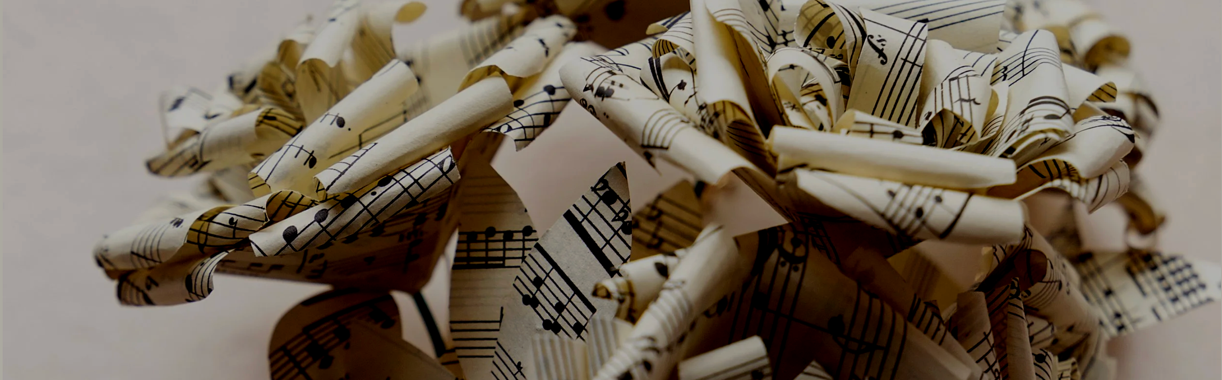 A tangled ball of paper with sheet music printed on it.