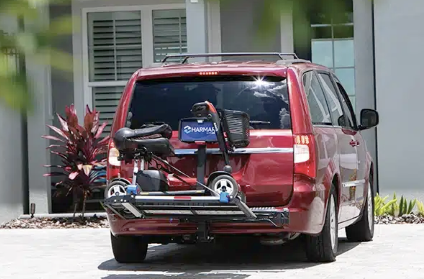Harmar AL300 with scooter on back of minivan.png