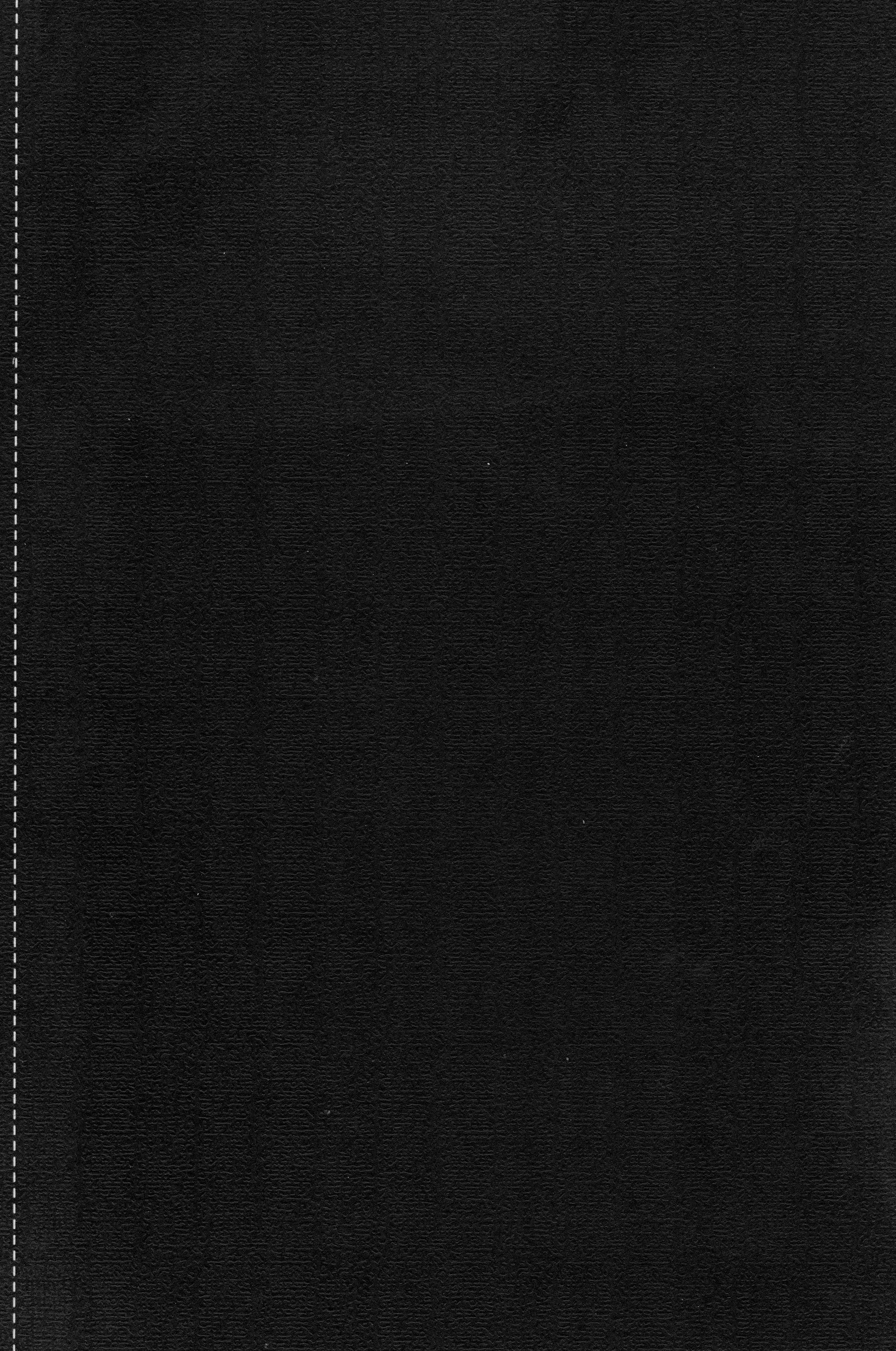 Close-up of a black textured surface, possibly leather or synthetic material, with white dashed and dotted lines along the left edge.