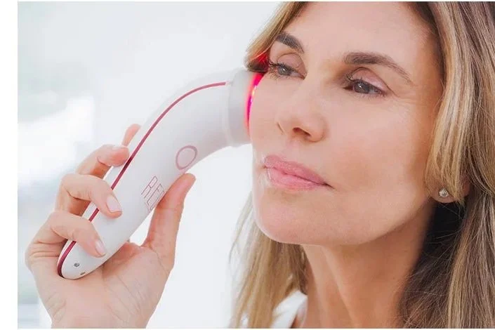 Patient receiving an Advanced Skin Rejuvenation Facial using Elevare red light which also has low-level laser technology to support healthier-looking skin.
