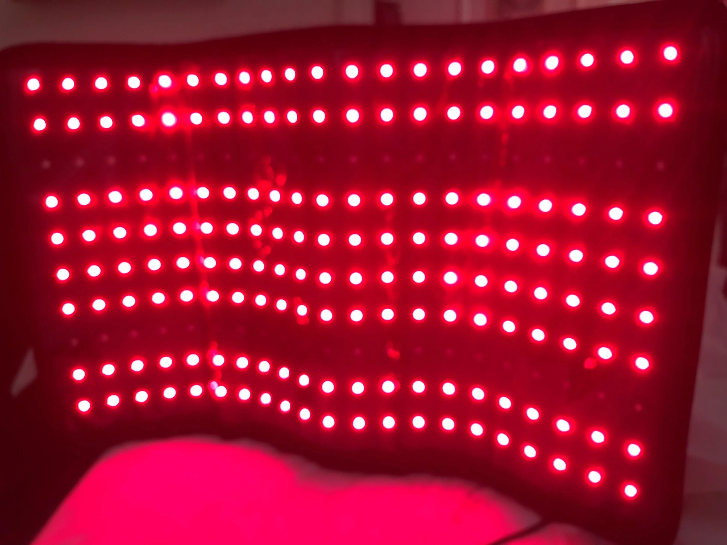 Pic of a red LED light therapy panel.