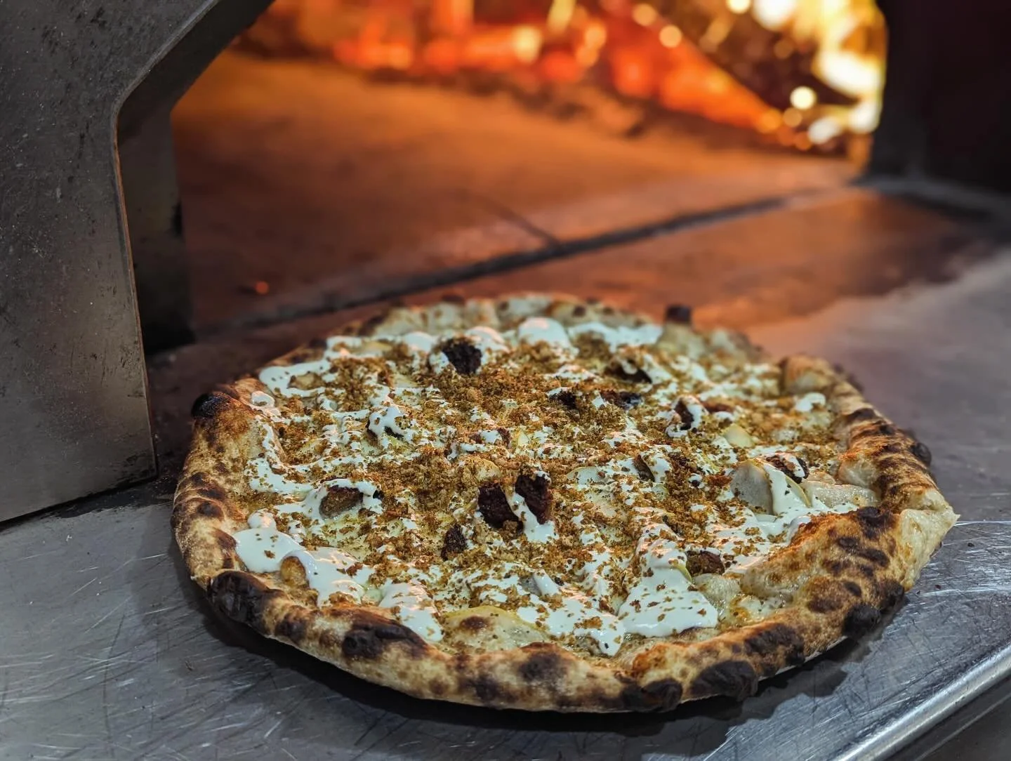 Happy last day of Chanukah! If you haven't tried our latest special, 🕎 Love You a Latke 🕎, we highly recommend it! It's a white pizza topped with pears and crispy Latke bits, finished with sweet sour cream, lemon juice and bread crumbs! 🍕 🦴 
&bul