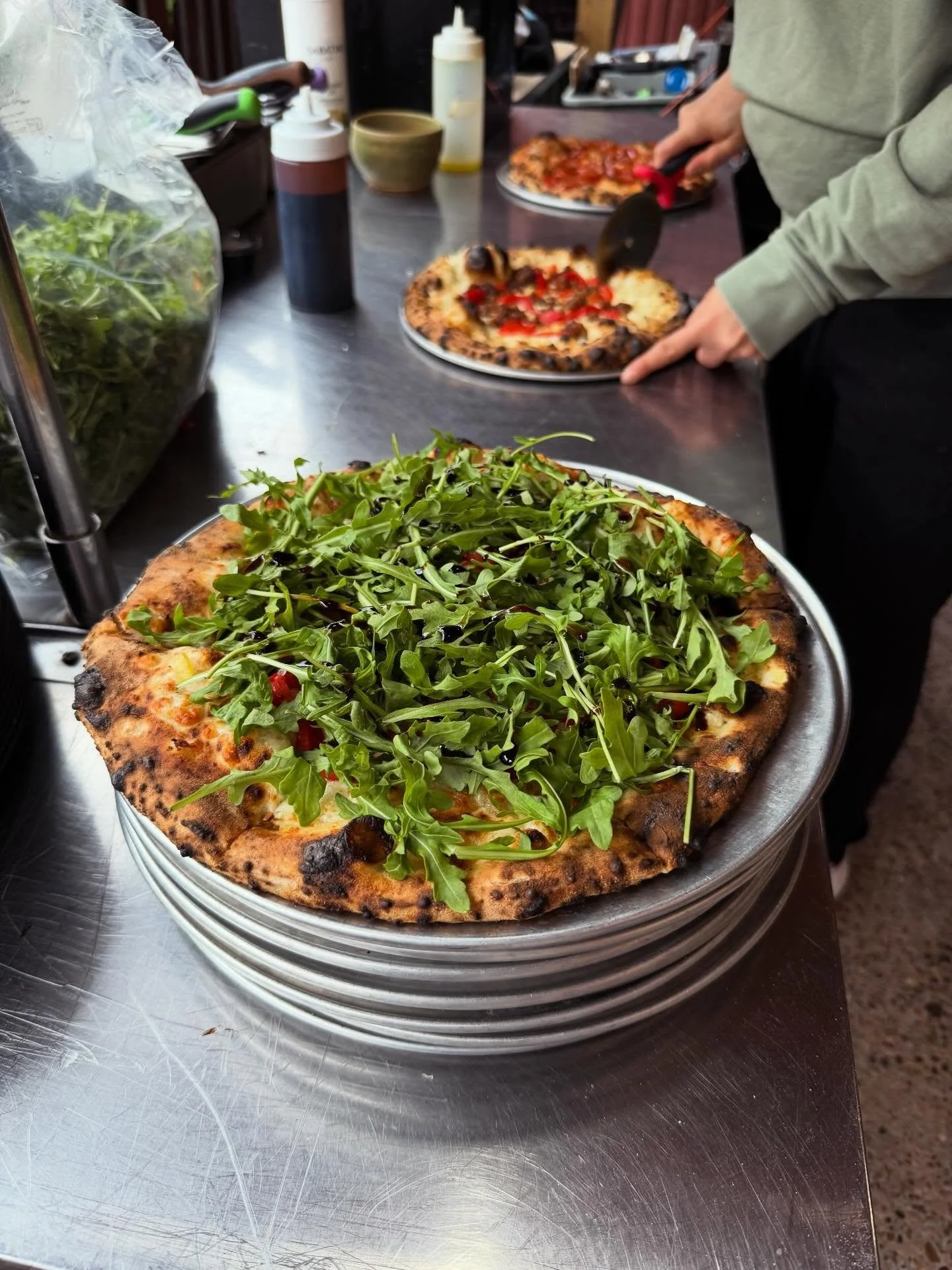 ‼️ new special! ‼️ Now on deck is the 🚀 Nixon-Aroo(gula) 🚀! This one is for you #futurama fans- a white pizza topped with house sausage, preserved lemon, roasted RED SCARE peppers, fresh arugula, and balsamic reduction. Get it while it's hot! 🍕 🦴