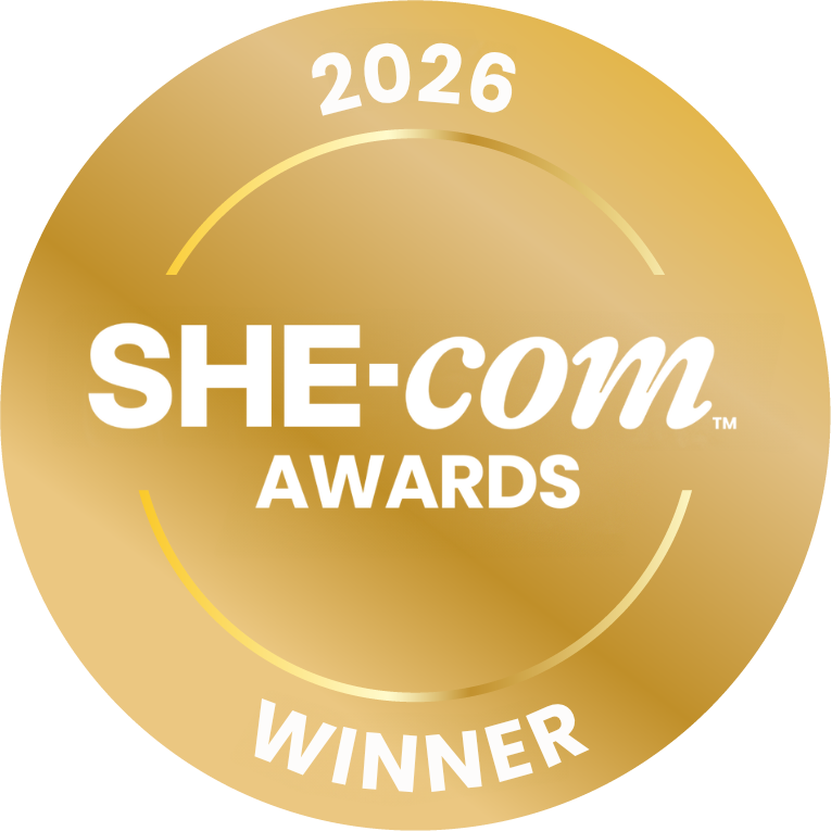 Gold circular award badge with white text that reads 'SHEcom AWARDS WINNER 2026'.
