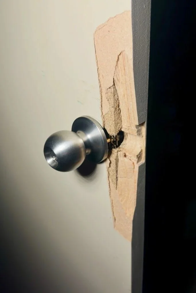 Damaged door from forced entry during a lockout in Geelong
