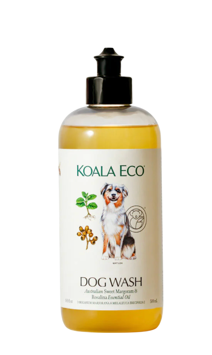 Bottle of Koala Eco Dog Wash with Australian sweet margoram and Rosalina essential oil, featuring a cartoon image of a dog and illustrations of plants.