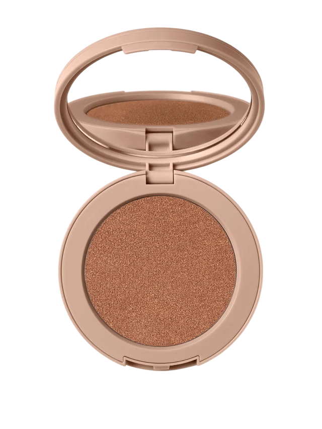 An open compact makeup case with a mirror, containing a bronze-colored powder inside.