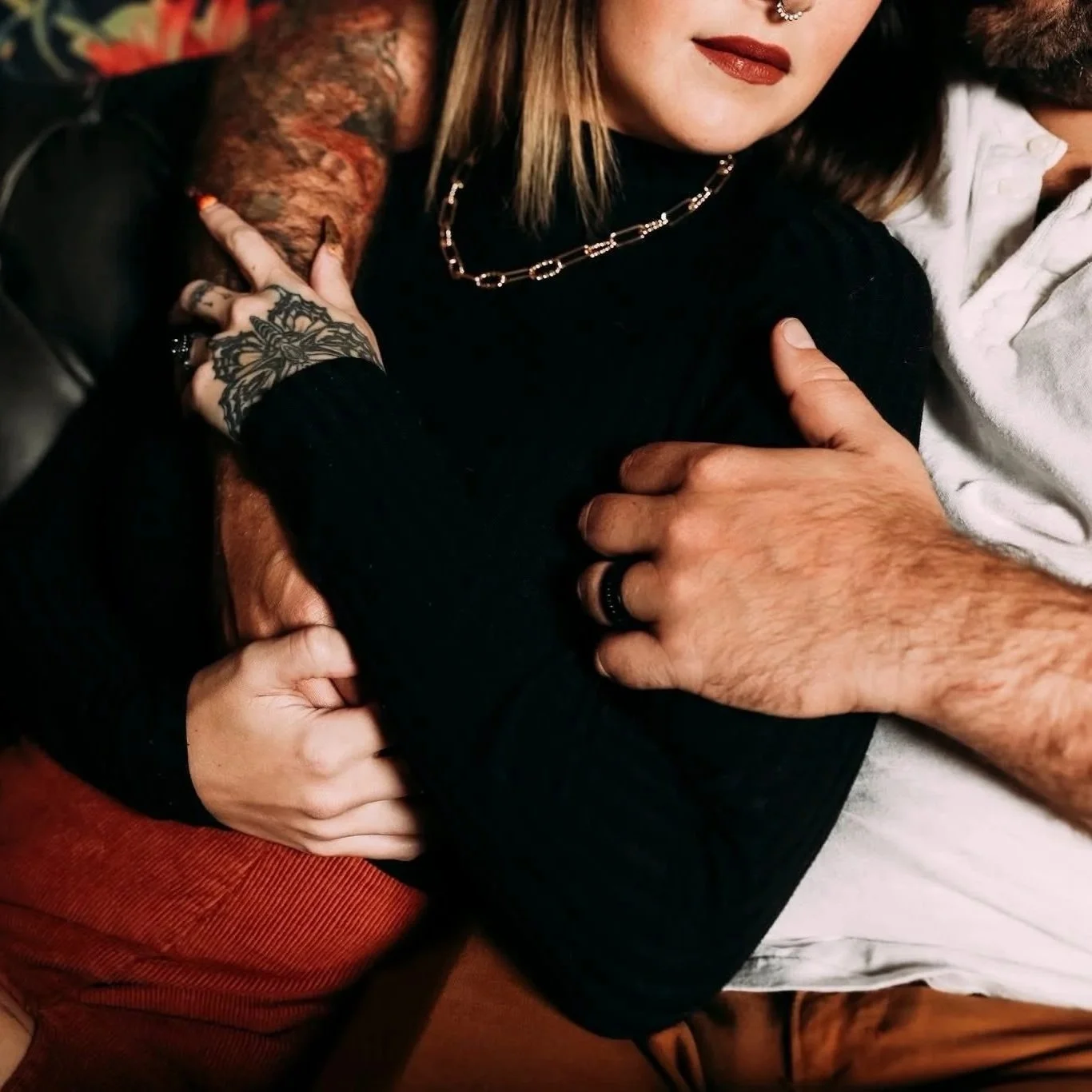 Dark and moody couples boudoir tattooed hands