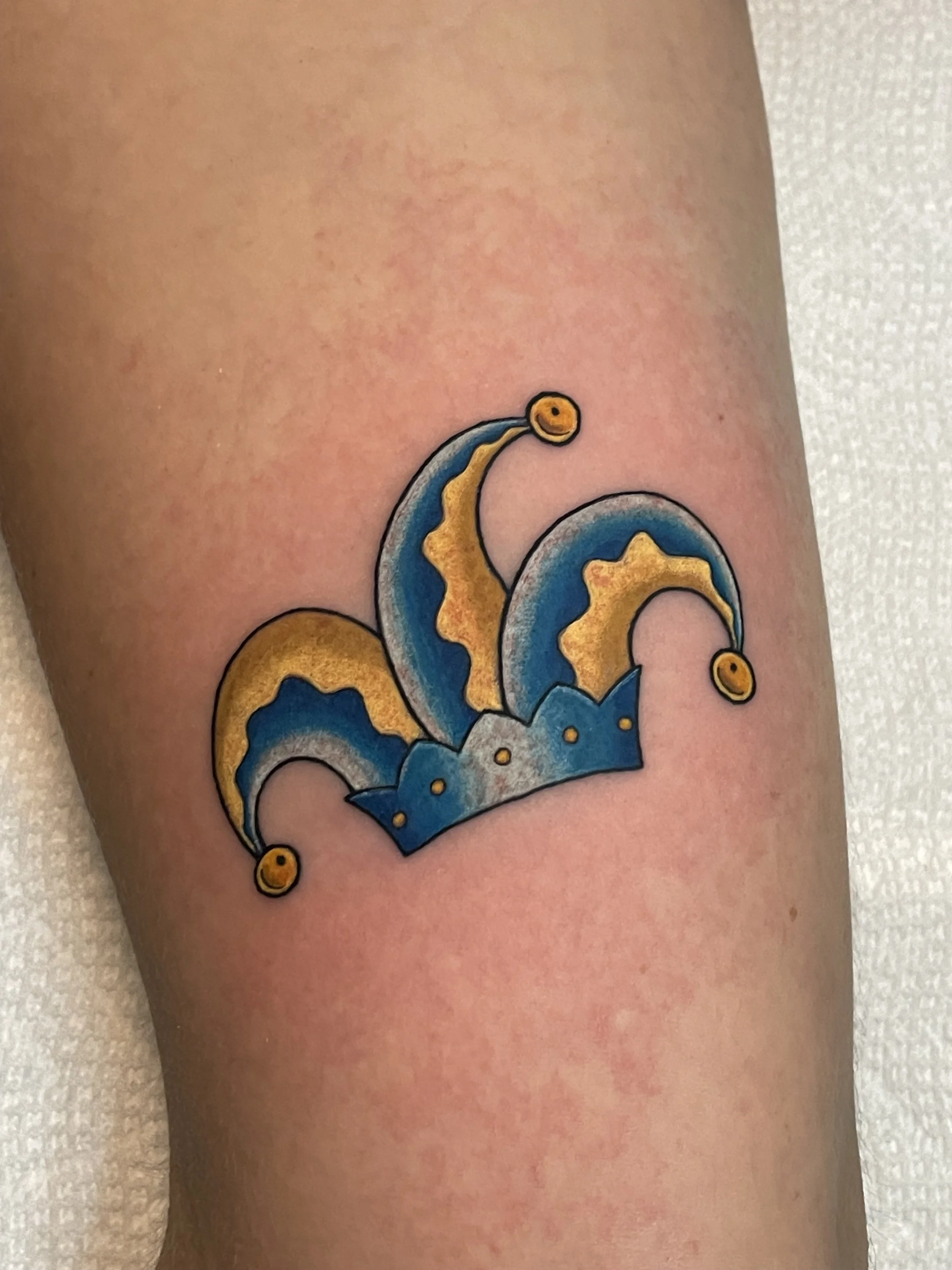 jester hat tattoo in color. 