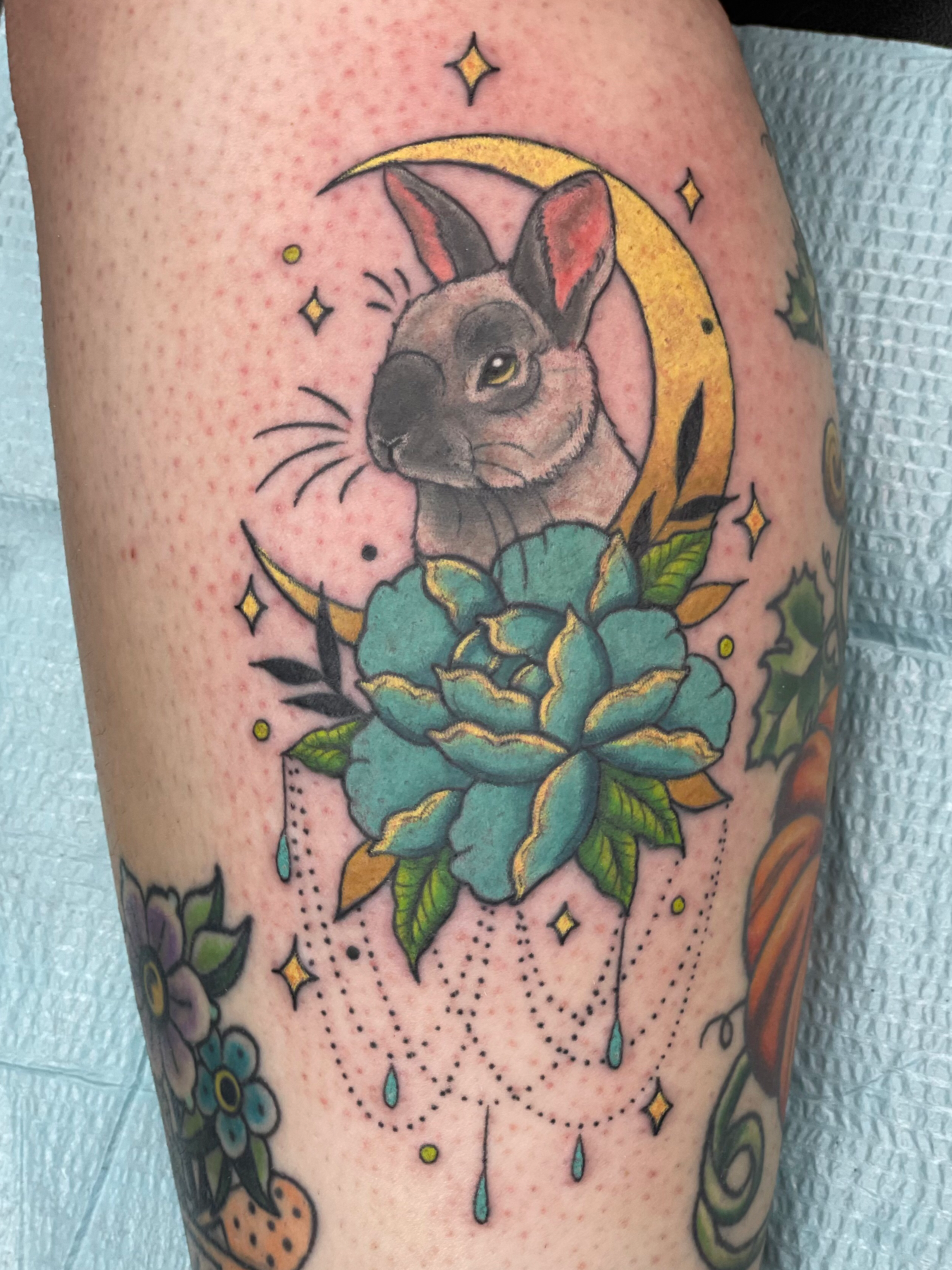 bunny in moon with peonies and stars and gems lol tattoo