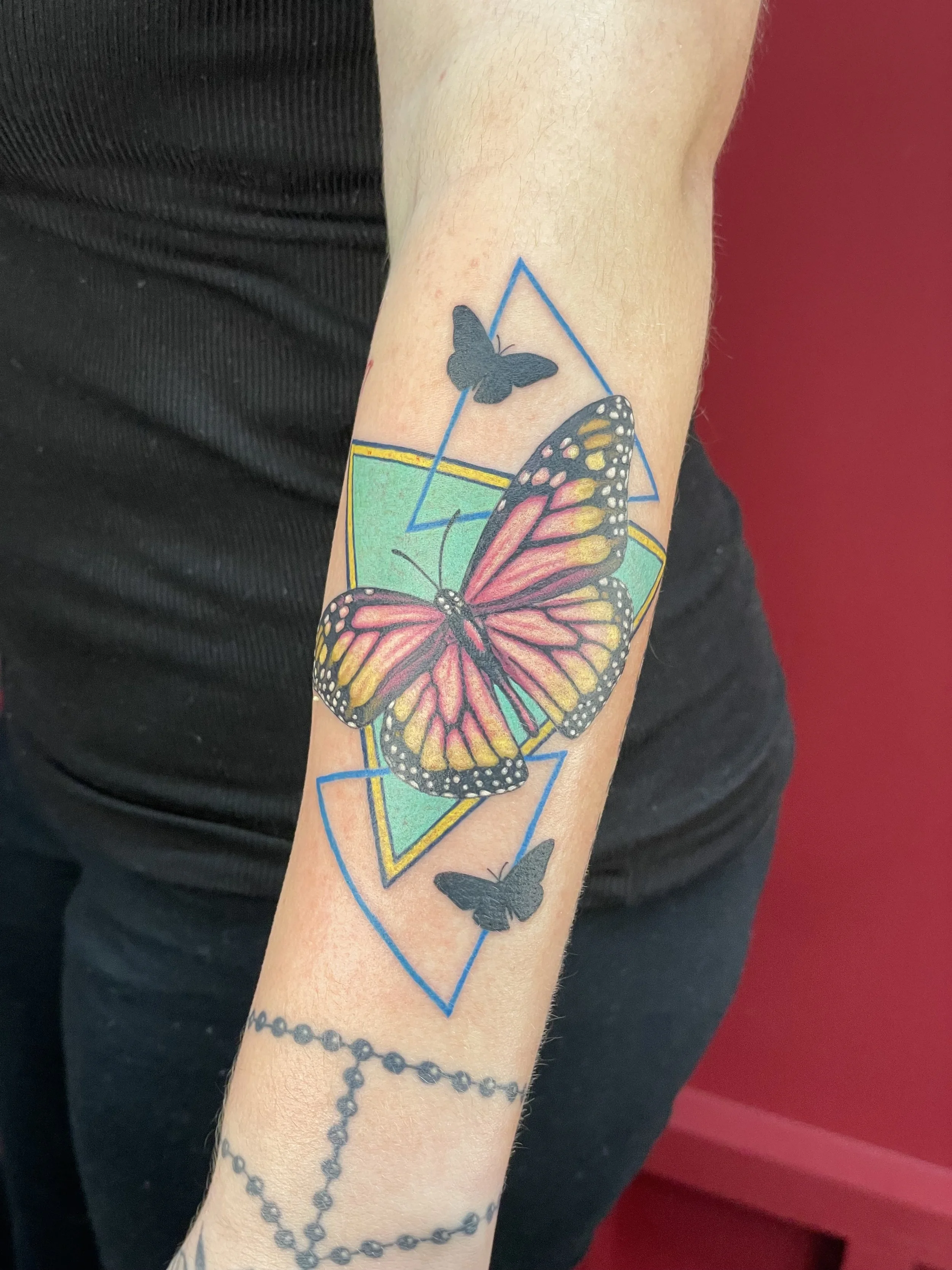 butterfly tattoo with triangles