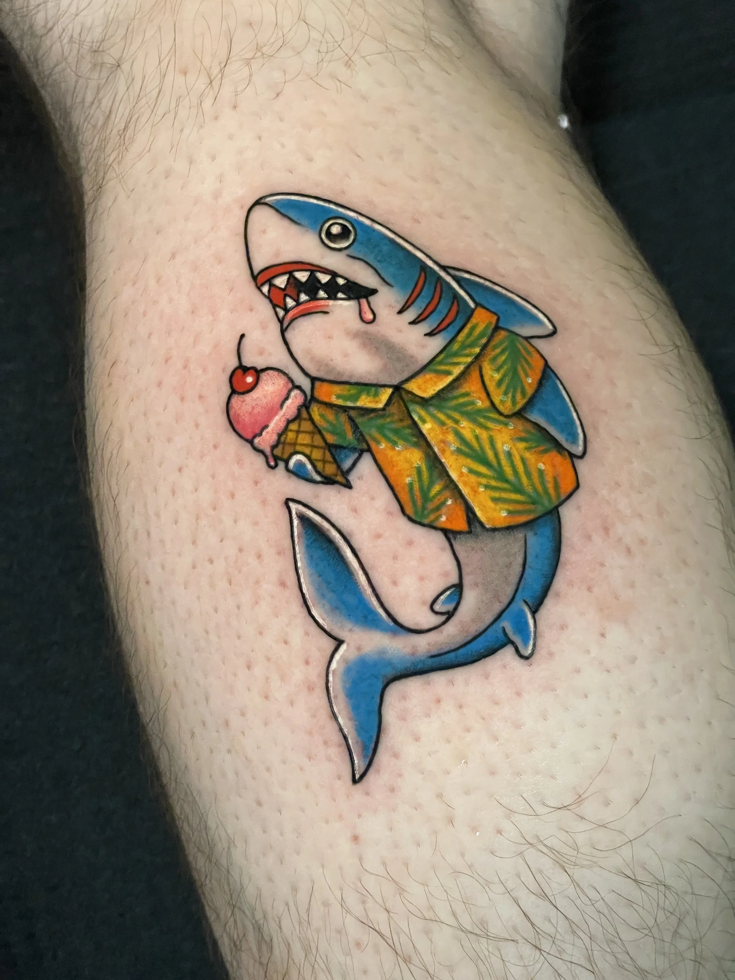 shark eating ice cream in a Hawaiian t shirt tattoo shark week