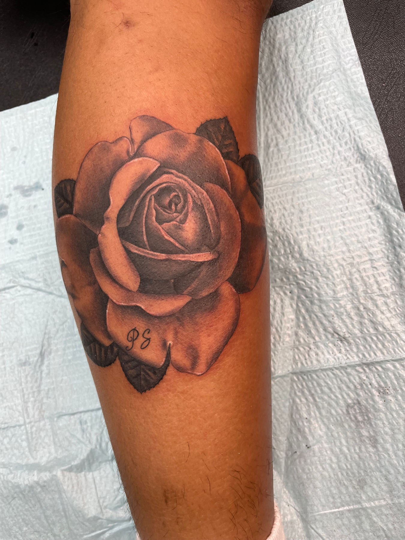 black and grey rose tattoo